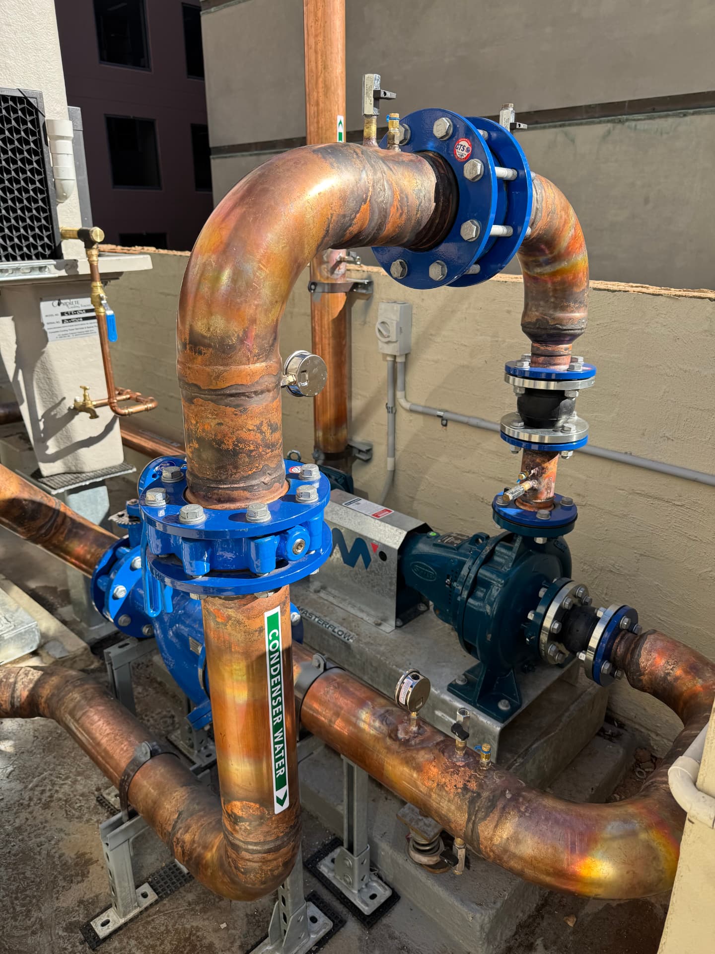 Industrial condenser water pump set with flanged valves and gauges